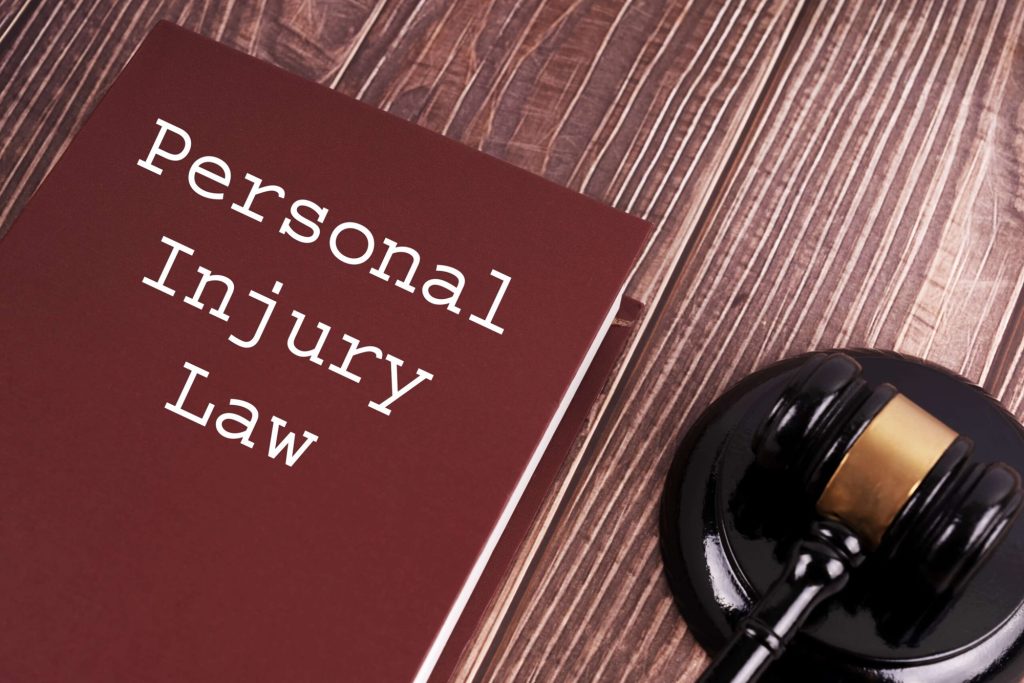 Law book and desk for the question are personal injury settlements taxable