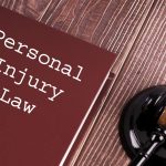 Law book and desk for the question are personal injury settlements taxable